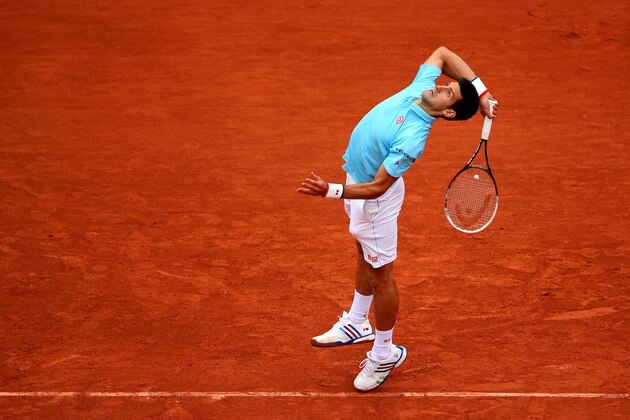PARIS, FRANCE - MAY 26:  Novak Djokovic of Serbia serves during his men's singles match against Joao Sousa of Portugal on day two of the French Open at Roland Garros on May 26, 2014 in Paris, France.  (Photo by Clive Brunskill/Getty Images)