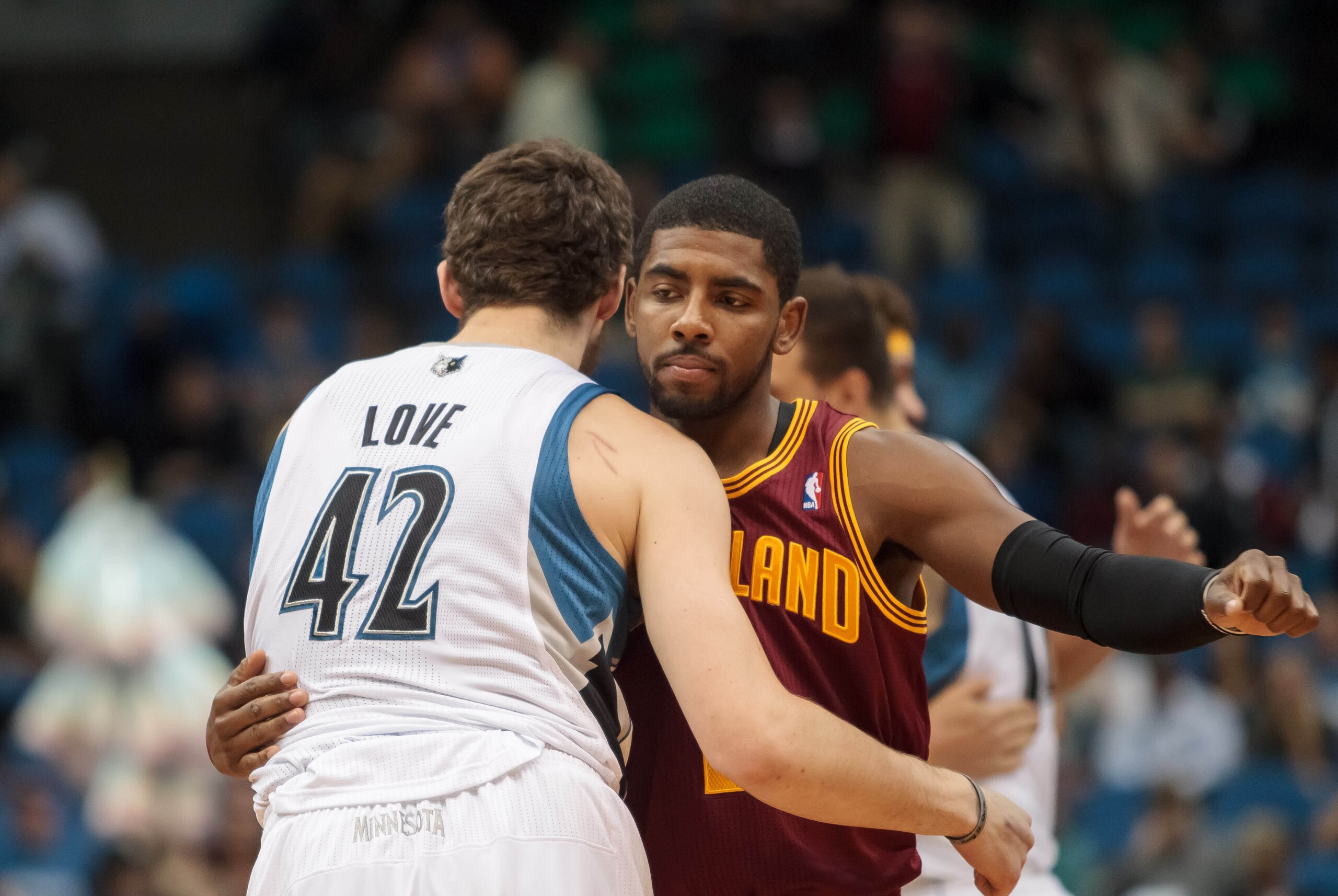 Nov 13, 2013; Minneapolis, MN, USA; Minnesota Timberwolves power forward Kevin Love (42) and Cleveland Cavaliers point guard Kyrie Irving (2) hug before the tip off at Target Center. Mandatory Credit: Brad Rempel-USA TODAY Sports