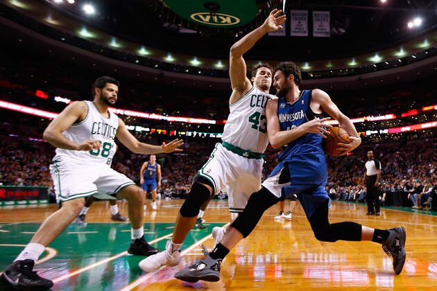 BOSTON, MA - DECEMBER 16: Kevin Love #42 of the Minnesota Timberwolves attempts to drive the baseline in front of Kris Humphries #43 and Vitor Faverani #38 of the Boston Celtics in the second half during the game at TD Garden on December 16, 2013 in Boston, Massachusetts. NOTE TO USER: User expressly acknowledges and agrees that, by downloading and or using this photograph, User is consenting to the terms and conditions of the Getty Images License Agreement.  (Photo by Jared Wickerham/Getty Images)