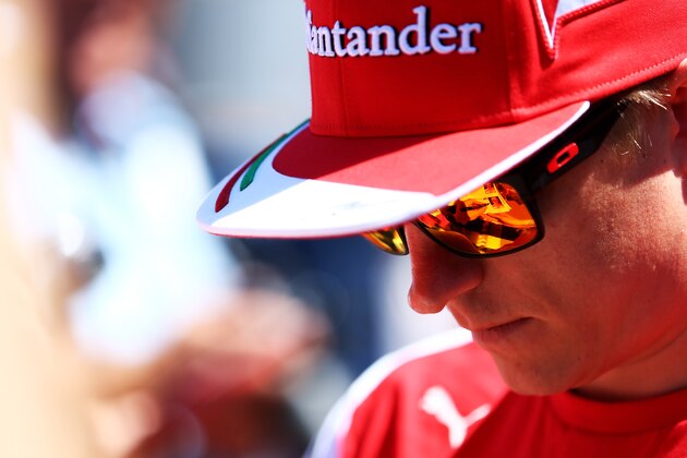 MONTE-CARLO, MONACO - MAY 23:  Kimi Raikkonen of Finland and Ferrari signs autographs for the fans ahead of the Monaco Formula One Grand Prix at Circuit de Monaco on May 23, 2014 in Monte-Carlo, Monaco.  (Photo by Mark Thompson/Getty Images)