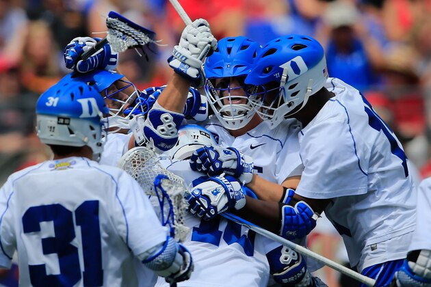 BALTIMORE, MD - MAY 24:  Christian Walsh #19 of the Duke Blue Devils (C) celebrates after scoring a second half goal against the Denver Pioneers during the semifinals of the 2014 NCAA Division I Men's Lacrosse Championship at M&T Bank Stadium on May 24, 2014 in Baltimore, Maryland.  (Photo by Rob Carr/Getty Images)