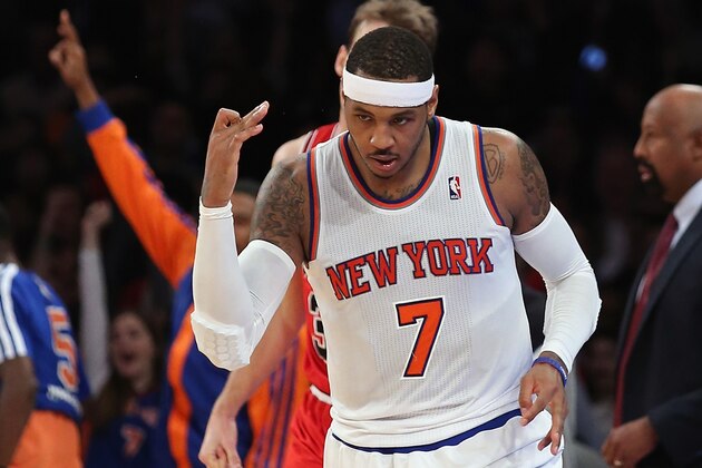 NEW YORK, NY - DECEMBER 11:  Carmelo Anthony #7 of the New York Knicks celebrates a three pointer in the second quarter against the Chicago Bulls at Madison Square Garden on December 11, 2013 in New York City. NOTE TO USER: User expressly acknowledges and agrees that, by downloading and or using this Photograph, user is consenting to the terms and conditions of the Getty Images License Agreement.  (Photo by Bruce Bennett/Getty Images)