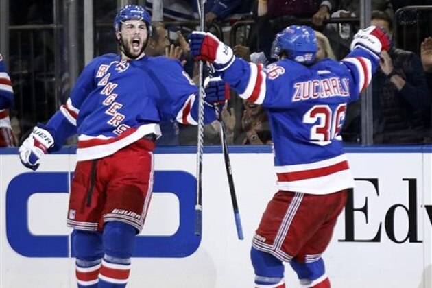 New York Rangers center Derick Brassard celebrates with right wing Mats Zuccarello (36) after scoring against the Montreal Canadiens during the second period of Game 4 of the NHL hockey Stanley Cup playoffs Eastern Conference finals, Sunday, May 25, 2014, in New York. (AP Photo/Kathy Willens)