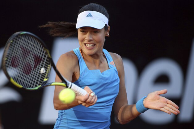Serbia's Ana Ivanovic strikes a forehand during her semifinal match against Serena Williams, at the Italian open tennis tournament in Rome, Saturday, May 17, 2014. Williams overcame a second-set lapse to beat 11th-seeded Ana Ivanovic 6-1, 3-6, 6-1 and gain a measure of revenge for a fourth-round loss to the Serb at this year's Australian Open. (AP Photo/Gregorio Borgia)