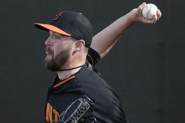 San Francisco Giants pitcher Heath Hembree throws during spring training baseball practice Sunday, Feb. 16, 2014, in Scottsdale, Ariz.  (AP Photo/Gregory Bull)