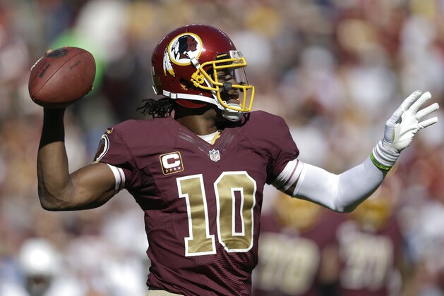 Washington Redskins quarterback Robert Griffin III passes the ball during the first half of a NFL football game against San Diego Chargers in Landover, Md., Sunday, Nov. 3, 2013. (AP Photo/Patrick Semansky)
