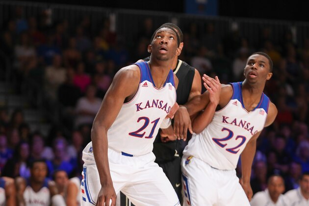 Nov 28, 2013; Paradise Island, BAHAMAS; Kansas Jayhawks center Joel Embiid (21) and guard Andrew Wiggins (22) look to rebound during the game against the Wake Forest Demon Deacons at the 2013 Battle 4 Atlantis in the Imperial Arena at the Atlantis Resort. Mandatory Credit: Kevin Jairaj-USA TODAY Sports