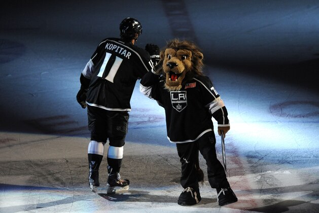 LOS ANGELES, CA - MAY 26:  Anze Kopitar #11 of the Los Angeles Kings and team mascot Bailey celebrate their team's victory over the Chicago Blackhawks after Game Four of the Western Conference Final during the 2014 Stanley Cup Playoffs at Staples Center on May 26, 2014 in Los Angeles, California. (Photo by Evan Gole/NHLI via Getty Images)