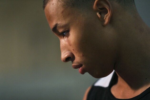 Dante Exum, from Australiam listens to a question before participating  in the 2014 NBA basketball draft combine Friday, May 16, 2014, in Chicago. (AP Photo/Charles Rex Arbogast)