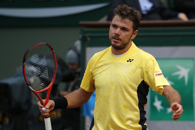 Switzerland's Stanislas Wawrinka reacts as he plays Spain's Guillermo Garcia-Lopez during their first round match of  the French Open tennis tournament at the Roland Garros stadium, in Paris, France, Monday, May 26, 2014. (AP Photo/Michel Euler)