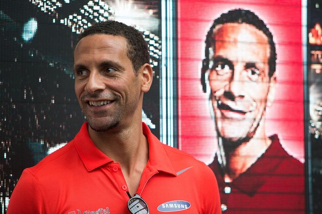 SINGAPORE - MAY 16:  Rio Ferdinand greets supporters during a meet-the-fans session on May 16, 2014 in Singapore.  (Photo by Nicky Loh/Getty Images)