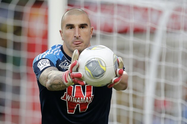 Saint Etienne goalkeeper Stephane Ruffier of France catches the ball during the French League One soccer match against Monaco, in Monaco stadium, Saturday, Oct. 5, 2013. (AP Photo/Lionel Cironneau)