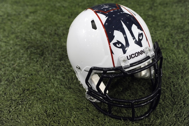 A Connecticut football helmet with new logo is seen during NCAA college football media day in Storrs, Conn., Friday, Aug. 9, 2013. (AP Photo/Jessica Hill)