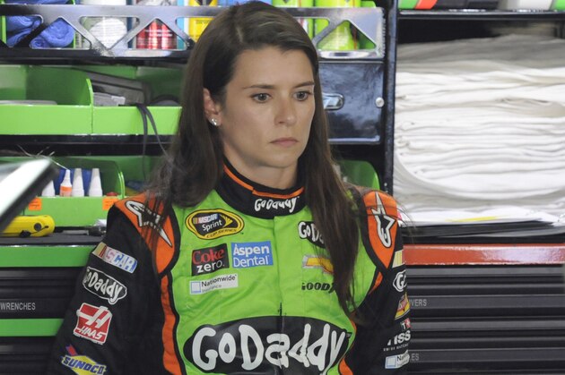 Danica Patrick watches as crew members work on her car before practice for Sunday's NASCAR Sprint Cup series Coca-Cola 600 auto race at Charlotte Motor Speedway in Concord, N.C., Thursday, May 22, 2014. (AP Photo/Mike McCarn)