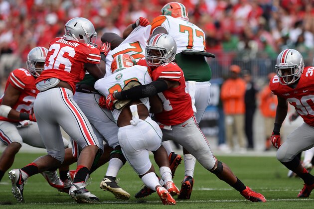 COLUMBUS, OH - SEPTEMBER 21:  Jamal Marcus #34 of the Ohio State Buckeyes makes the tackle on ballcarrier Omari Albert #32 of the Florida A&M Rattlers in the fourth quarter at Ohio Stadium on September 21, 2013 in Columbus, Ohio. Ohio State defeated FAMU 76-0.   (Photo by Jamie Sabau/Getty Images)