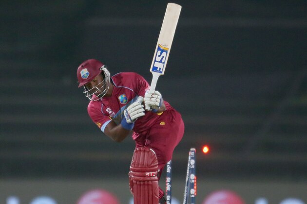 DHAKA, BANGLADESH - APRIL 03:  Dwayne Smith of the West Indies is bowled out by Lasith Malinga of Sri Lanka during the ICC World Twenty20 Bangladesh 2014 1st Semi-Final match between Sri Lanka and the West Indies at Sher-e-Bangla Mirpur Stadium on April 3, 2014 in Dhaka, Bangladesh.  (Photo by Scott Barbour/Getty Images)