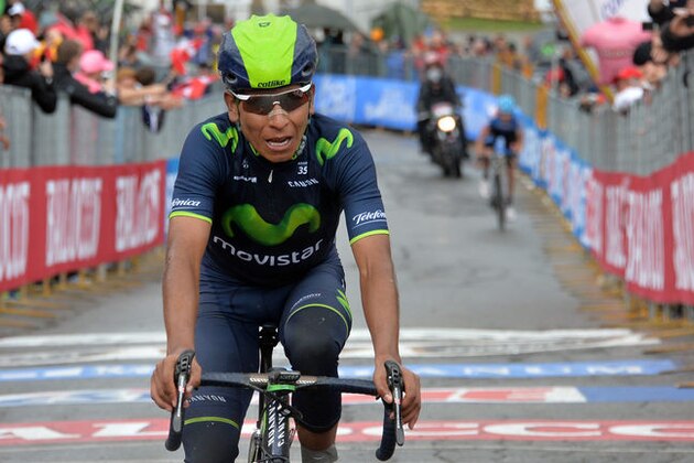 Colombia's Nairo Quintana crosses the finish line to win the 16th stage of the Giro d'Italia cycling race from Ponte di Legno to Val Martello, Italy, Tuesday, May 27, 2014. Nairo Quintana moved into the overall lead in the Giro d'Italia after winning a tough and controversial stage, in difficult weather conditions across the legendary Gavia and Stelvio climbs. (AP Photo/Gian Mattia D'Alberto)