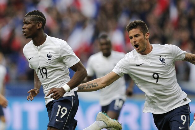 Paul Pogba of France, left, and Olivier Giroud celebrate a goal during the friendly soccer match between France and Norway at the Stade de France stadium in Saint Denis, outside Paris, Tuesday, May 27, 2014. France are preparing for the upcoming soccer World Cup in Brazil starting on 12 June. (AP Photo/Christophe Ena)
