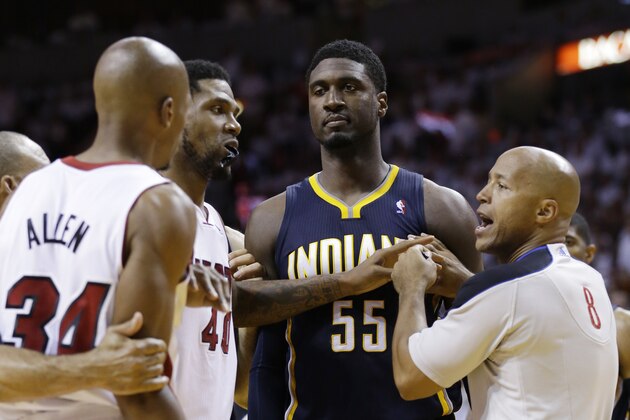 Official Marc Davis (8) and Miami Heat forward Udonis Haslem (40), separate, Indiana Pacers center Roy Hibbert (55) and Miami Heat guard Ray Allen (34), during the second half of Game 4 in the NBA basketball Eastern Conference finals playoff series, Monday, May 26, 2014, in Miami. (AP Photo/Wilfredo Lee)