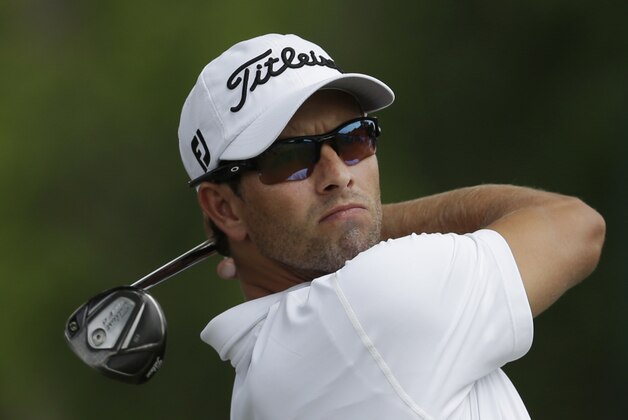 Adam Scott watches his tee shot on the second hole during the final round of the PGA Colonial golf tournament in Fort Worth, Texas, Sunday, May 25, 2014. (AP Photo/LM Otero)