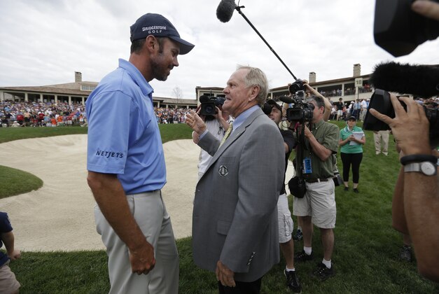 Matt Kuchar is congratulated by Jack Nicklaus after Kuchar won the Memorial golf tournament Sunday, June 2, 2013, in Dublin, Ohio. (AP Photo/Darron Cummings)