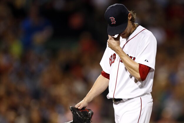 May 21, 2014; Boston, MA, USA; Boston Red Sox starting pitcher Clay Buchholz (11) reacts during the fifth inning of a game against the Toronto Blue Jays at Fenway Park. Mandatory Credit: Mark L. Baer-USA TODAY Sports