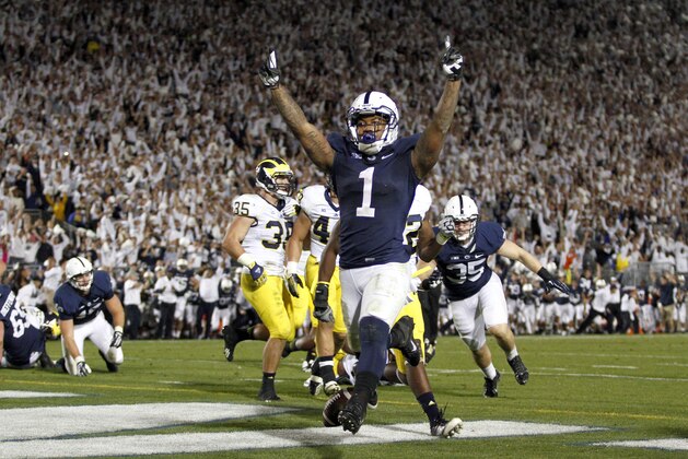 STATE COLLEGE, PA - OCTOBER 12:  Bill Belton #1 of the Penn State Nittany Lions celebrates after rushing for the game winning touchdown against the Michigan Wolverines during the game on October 12, 2013 at Beaver Stadium in State College, Pennsylvania.  The Nittany Lions defeated the Wolverines 43-40 in four overtimes.  (Photo by Justin K. Aller/Getty Images)