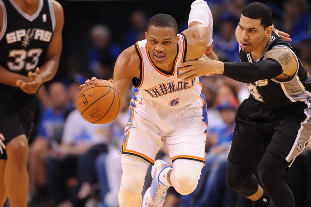 OKLAHOMA CITY, OK - MAY 27: Russell Westbrook #0 of the Oklahoma City Thunder dribbles up the court against the San Antonio Spurs in Game Four of the Western Conference Finals during the 2014 NBA Playoffs on May 27, 2014 at the Chesapeake Energy Arena in Oklahoma City,Oklahoma.  NOTE TO USER: User expressly acknowledges and agrees that, by downloading and or using this photograph, User is consenting to the terms and conditions of the Getty Images License Agreement. Mandatory Copyright Notice: Copyright 2014 NBAE  (Photo by Noah Graham/NBAE via Getty Images)