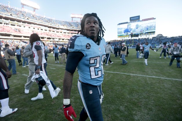 Tennessee Titans running back Chris Johnson (28) leaves the field after the Titans beat the Houston Texans 16-10 in an NFL football game Sunday, Dec. 29, 2013, in Nashville, Tenn. (AP Photo/Wade Payne)