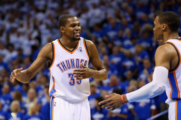 OKLAHOMA CITY, OK - MAY 27: Kevin Durant #35 and Russell Westbrook #0 of the Oklahoma City Thunder react after a play in the third quarter against the San Antonio Spurs during Game Four of the Western Conference Finals of the 2014 NBA Playoffs at Chesapeake Energy Arena on May 27, 2014 in Oklahoma City, Oklahoma. NOTE TO USER: User expressly acknowledges and agrees that, by downloading and or using this photograph, User is consenting to the terms and conditions of the Getty Images License Agreement.  (Photo by Ronald Martinez/Getty Images)