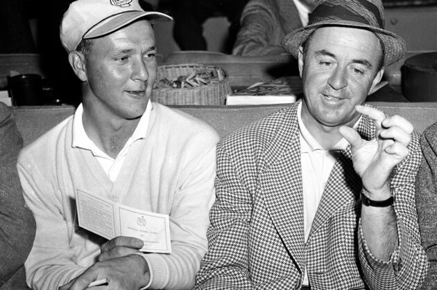Arnold Palmer, left, and Sam Snead rehash their third round play in the Masters Golf Tournament at the Augusta National Golf Club in August, Ga., April 5, 1958.  Palmer and Snead wound up in a tie for the lead with a 54 hole total of 211.  (AP Photo)