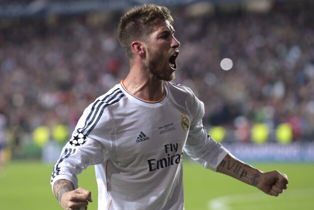 Real's Sergio Ramos, gestures, after scoring his side's first goal , during the Champions League final soccer match between Atletico Madrid and Real Madrid, at the Luz stadium, in Lisbon, Portugal, Saturday, May 24, 2014. (AP Photo/Manu Fernandez)