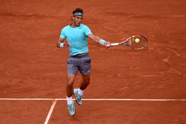 PARIS, FRANCE - MAY 26:  Rafael Nadal of Spain returns a shot during his men's singles match against Robby Ginepri of the United States on day two of the French Open at Roland Garros on May 26, 2014 in Paris, France.  (Photo by Matthias Hangst/Getty Images)