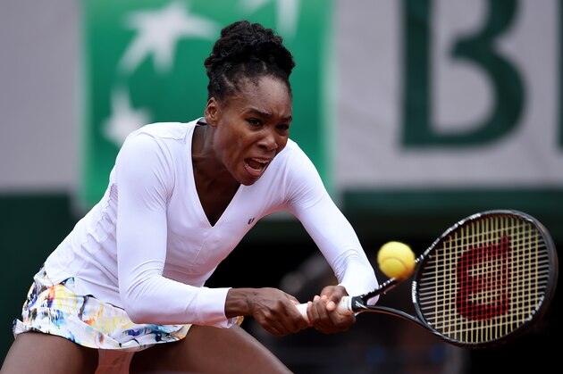 PARIS, FRANCE - MAY 28:  Venus Williams of the United States returns a shot during her women's singles match against Anna Schmiedlova of Slovakia on day four of the French Open at Roland Garros on May 28, 2014 in Paris, France.  (Photo by Matthias Hangst/Getty Images)