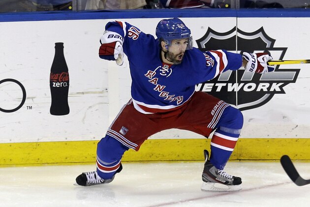 New York Rangers' Martin St. Louis celebrates his game-winning goal during overtime in Game 4 of the NHL hockey Stanley Cup playoffs Eastern Conference finals against the Montreal Canadiens, Sunday, May 25, 2014, in New York. The Rangers defeated the Canadiens in overtime 3-2. (AP Photo/Seth Wenig)