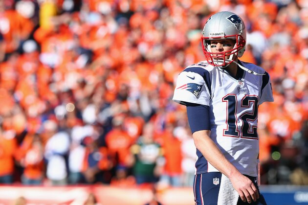DENVER, CO - JANUARY 19:  Tom Brady #12 of the New England Patriots in action against the Denver Broncos during the AFC Championship game at Sports Authority Field at Mile High on January 19, 2014 in Denver, Colorado.  (Photo by Elsa/Getty Images)