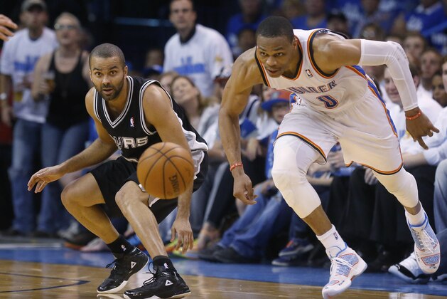 San Antonio Spurs guard Tony Parker, left, and Oklahoma City Thunder guard Russell Westbrook (0) watch a loose ball in the second quarter of Game 4 of the Western Conference finals NBA basketball playoff series in Oklahoma City, Tuesday, May 27, 2014. (AP Photo/Sue Ogrocki)