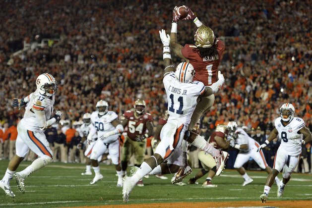 Jan 6, 2014; Pasadena, CA, USA; Florida State Seminoles wide receiver Kelvin Benjamin (1) catches a touchdown pass over Auburn Tigers cornerback Chris Davis (11) during the second half of the 2014 BCS National Championship game at the Rose Bowl.  Mandatory Credit: Robert Hanashiro-USA TODAY Sports