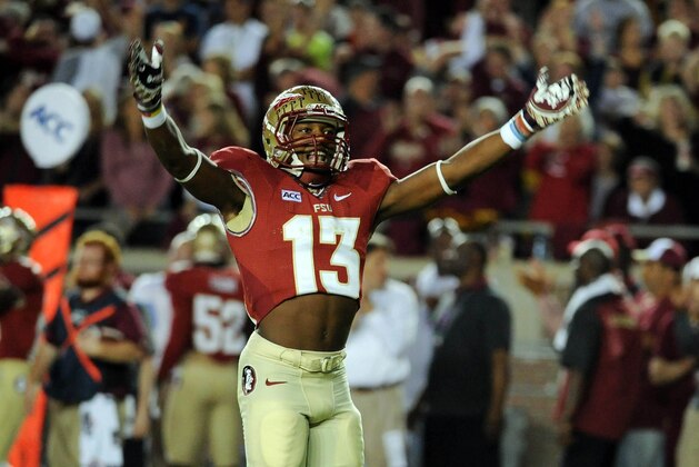 Nov 2, 2013; Tallahassee, FL, USA; Florida State Seminoles defensive back Jalen Ramsey (13) celebrates after a defensive stop during the game against the Miami Hurricanes at Doak Campbell Stadium. Mandatory Credit: Melina Vastola-USA TODAY Sports
