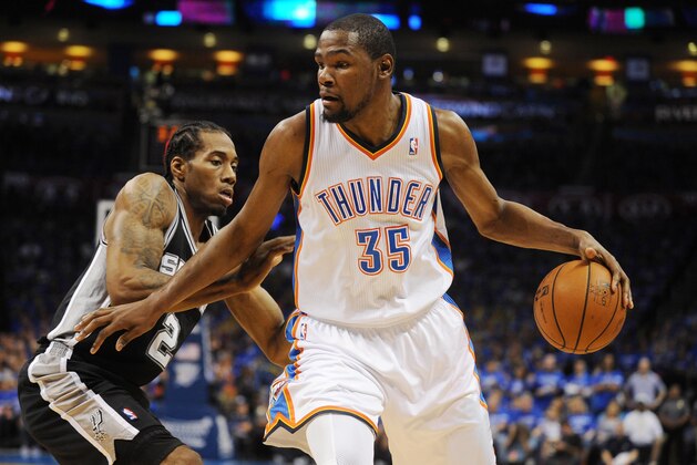 May 25, 2014; Oklahoma City, OK, USA; Oklahoma City Thunder forward Kevin Durant (35) handles the ball against San Antonio Spurs forward Kawhi Leonard (2) during the second quarter in game three of the Western Conference Finals of the 2014 NBA Playoffs at Chesapeake Energy Arena. Mandatory Credit: Mark D. Smith-USA TODAY Sports