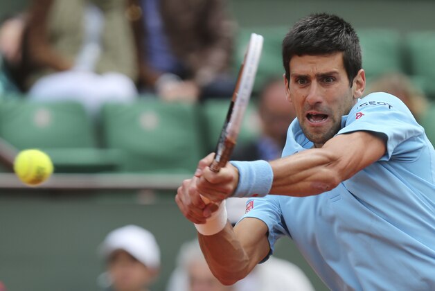 Serbia's Novak Djokovic returns the ball to France's Jeremy Chardy during their second round match of  the French Open tennis tournament at the Roland Garros stadium, in Paris, France, Wednesday, May 28, 2014. (AP Photo/David Vincent)