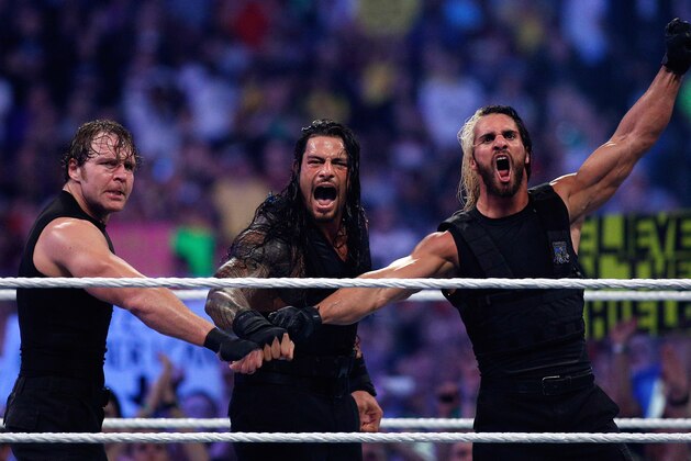 The Shield reacts after their win during Wrestlemania XXX at the Mercedes-Benz Super Dome in New Orleans on Sunday, April 6, 2014. (Jonathan Bachman/AP Images for WWE)
