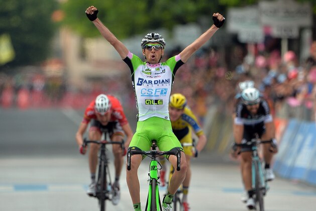 Italy's Stefano Pirazzi celebrates as he crosses the finish line to win the 17th stage of the Giro d' Italia cycling race from Sarnonico to Vittorio Veneto, Italy, Wednesday, May 28, 2014. Stefano Pirazzi won the 17th stage of the Giro d'Italia on Wednesday, while Nairo Quintana retained the overall leader's pink jersey. Pirazzi, who had led from the breakaway, made his move with little more than a kilometer remaining and edged out Tim Wellens and Jay McCarthy in a sprint at the end of the 204-kilometer (127-mile) stage from Sarnonico to Vittorio Veneto. (AP Photo/Gian Mattia D'Alberto)
