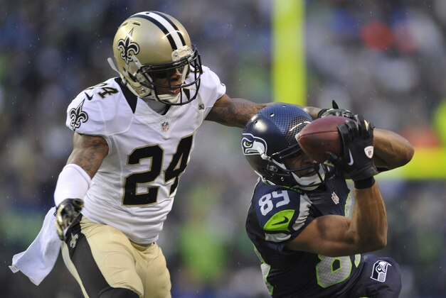 Jan 11, 2014; Seattle, WA, USA; Seattle Seahawks wide receiver Doug Baldwin (89) catches a pass against New Orleans Saints cornerback Corey White (24) during the second half of the 2013 NFC divisional playoff football game at CenturyLink Field. Mandatory Credit: Steven Bisig-USA TODAY Sports