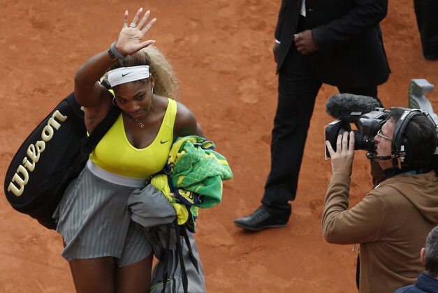 Serena Williams of the U.S. leaves after losing her second round match of the French Open tennis tournament in two sets 2-6, 2-6, against Spain's Garbine Muguruza at the Roland Garros stadium, in Paris, France, Wednesday, May 28, 2014. (AP Photo/Darko Vojinovic)