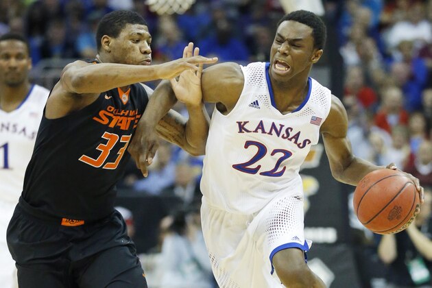 Kansas guard Andrew Wiggins (22) is covered by Oklahoma State guard Marcus Smart (33) during the second half of an NCAA college basketball game in the quarterfinals of the Big 12 Conference men's tournament in Kansas City, Mo., Thursday, March 13, 2014. Kansas defeated Oklahoma State 77-70 in overtime. (AP Photo/Orlin Wagner) Kansas guard Andrew Wiggins (22) is covered by Oklahoma State guard Marcus Smart (33) during the second half of an NCAA college basketball game in the quarterfinals of the Big 12 Conference men's tournament in Kansas City, Mo., Thursday, March 13, 2014. Kansas defeated Oklahoma State 77-70 in overtime. (AP Photo/Orlin Wagner)