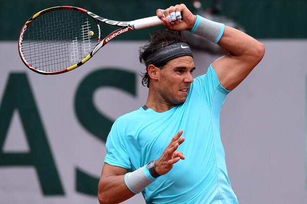 PARIS, FRANCE - MAY 26:  Rafael Nadal of Spain returns a shot during his men's singles match against Robby Ginepri of the United States on day two of the French Open at Roland Garros on May 26, 2014 in Paris, France.  (Photo by Matthias Hangst/Getty Images)