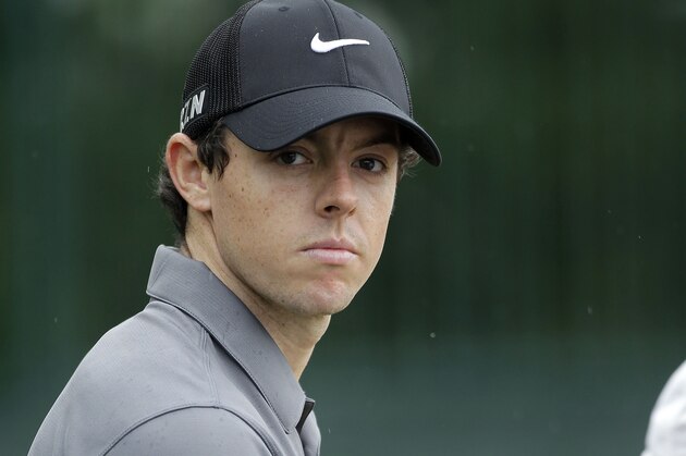 Rory McIlroy signs autographs for fans as he finishes his round in the pro-am of the Wells Fargo Championship golf tournament at Quail Hollow Club in Charlotte, N.C., Wednesday, April 30, 2014. (AP Photo/Bob Leverone)