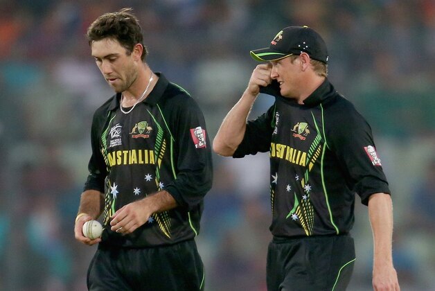 DHAKA, BANGLADESH - MARCH 28:  Glenn Maxwell and George Bailey of Australia look on in the field during the ICC World Twenty20 Bangladesh 2014 match between Australia and the West Indies at Sher-e-Bangla Mirpur Stadium on March 28, 2014 in Dhaka, Bangladesh.  (Photo by Scott Barbour/Getty Images)