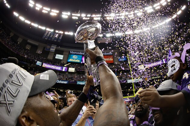 NEW ORLEANS, LA - FEBRUARY 03:  The Baltimore Ravens celebrate with the Vince Lombardi Championship trophy celebrate after the Ravens won 34-31 against the San Francisco 49ers during Super Bowl XLVII at the Mercedes-Benz Superdome on February 3, 2013 in New Orleans, Louisiana.  (Photo by Ezra Shaw/Getty Images)